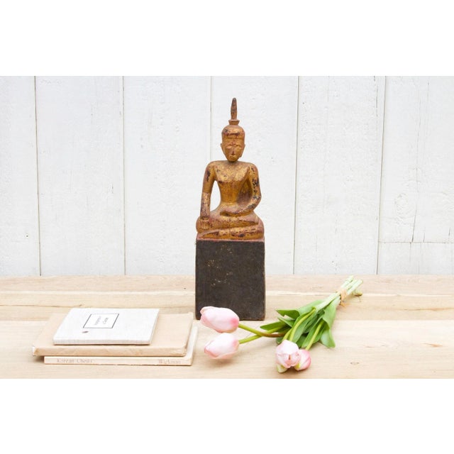 This exquisite Buddha statue is a meticulously crafted wooden masterpiece that once graced a temple shrine in Northern...