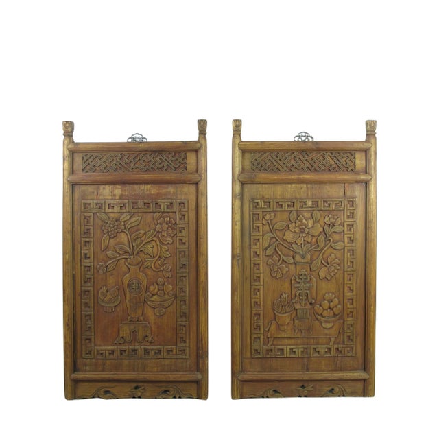Exquisitely hand carved wall hanging panels. This pair panel shows nicely hand carved still decorative objects and will be...