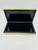 This is a vintage Italian gold-tone metal trinket or jewelry box with a sleek rectangular shape and striped ridged design...
