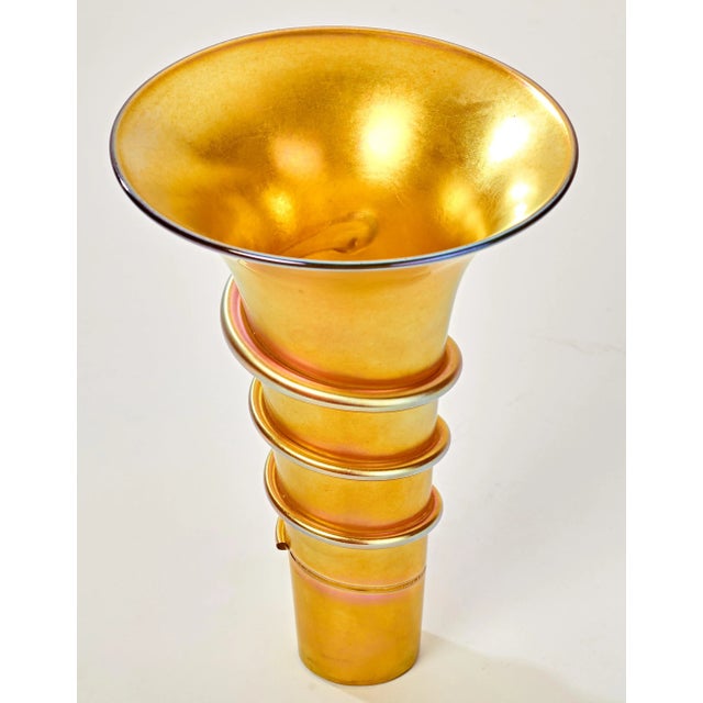 Iridescent gold glass lamp shade. Hand blown glass with spiraling glass ribbon band. A small portion (about 1.5 to 2 inch...