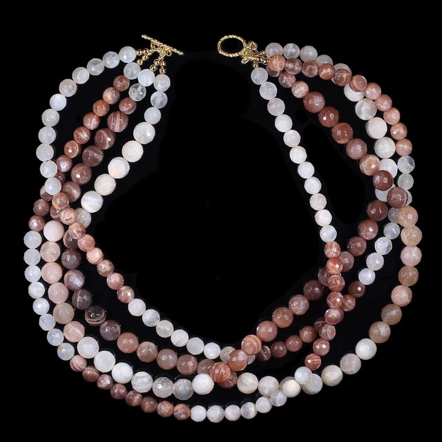 This beautiful 18-inch four-strand moonstone necklace displays a rich blend of earthy, sophisticated colors, including...