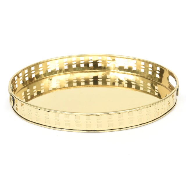 This vintage, fabulous and ulitarian oval brass tray has square openings and handles. Great barware and for all your...