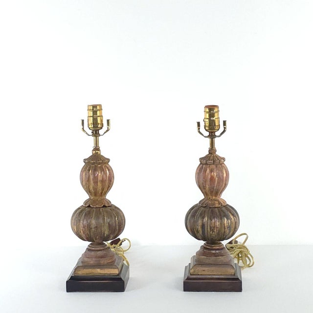 A pair of carved antique giltwood finials in the Orientalist style, now lamps, Italy, 19th century.