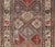 antique Bakhtiari rug in Geometric motifs and diamond design in the background. the background is composed of light and...