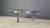 Beautiful coffee table with a steel tripod base and a gorgeous glass top by Jos Van Beek for Metaform, Netherlands. 1980s...