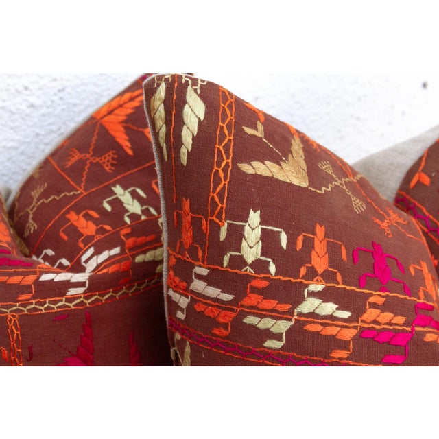 This curated set of two 18-inch square pillows offers a rare opportunity for symmetry, handcrafted from the same Antique...