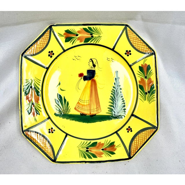 Signed by the artist EB. HB Quimper France logo on underside. Large octagonal Quimper Bretonne Lady plate. The plate...