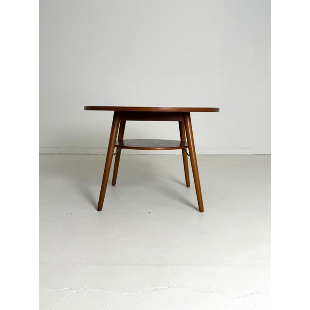 Round coffee table – teak & beech, 1960s a beautifully timeless danish coffee table from the 1960s. It features a warm-...
