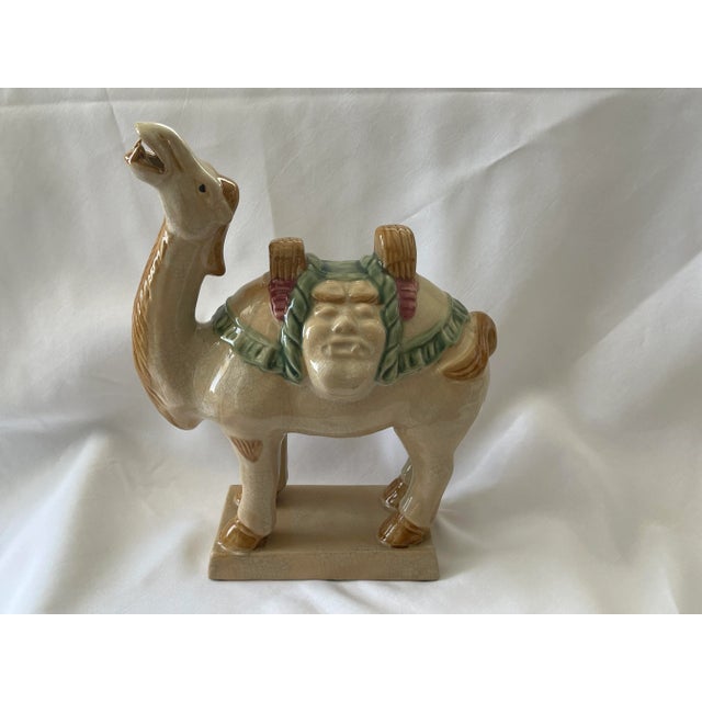 Offering a dynamic vintage Chinese Tang style ceramic camel statue, circa 1970s. This particular sculpture is quite heavy...