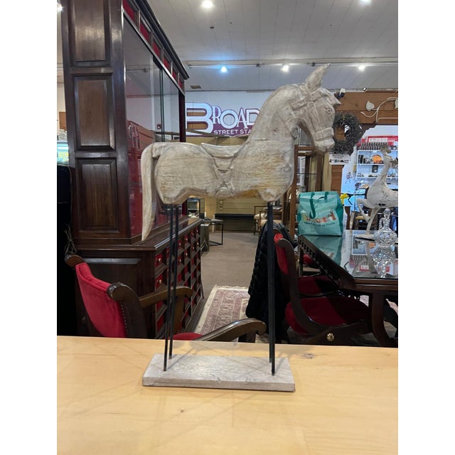 This striking vintage horse sculpture features a beautifully hand-carved equestrian form mounted on a minimalist iron...