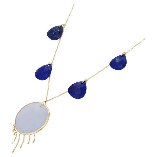 This is part of Chairish’s Fine Jewelry assortment. Lapis and Chalcedony Necklace in 18K Gold studded with pear and round...