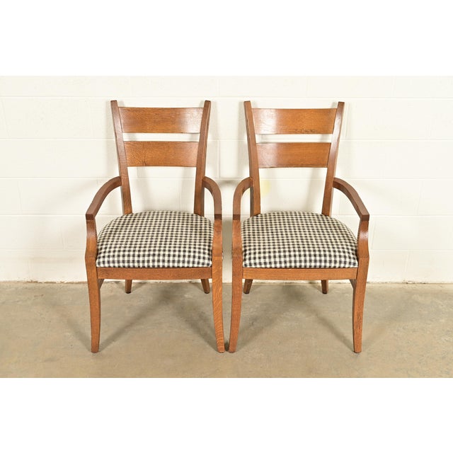 An exceptional pair of Mission or Arts & Crafts style armchairs or dining captain chairs By Stickley USA, Circa Late 20th...