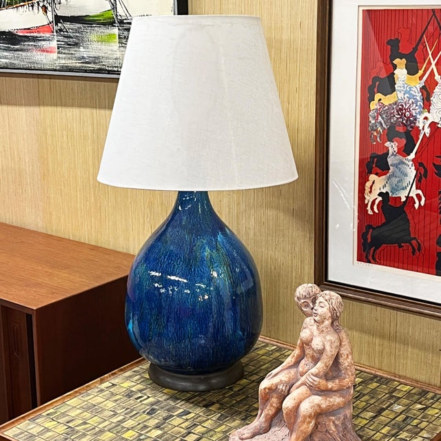Mid-Century Modern Italian ceramic table lamp with stunning blue glaze. The large, bulbous lamp is exemplary of Italian...