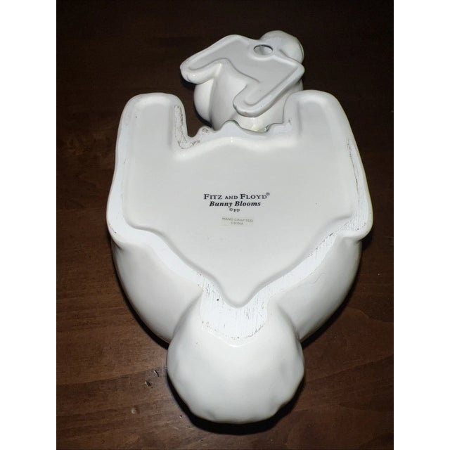 Charming vintage Fitz & Floyd “Bunny Blooms” cookie jar featuring a whimsical spring scene with two adorable rabbits...