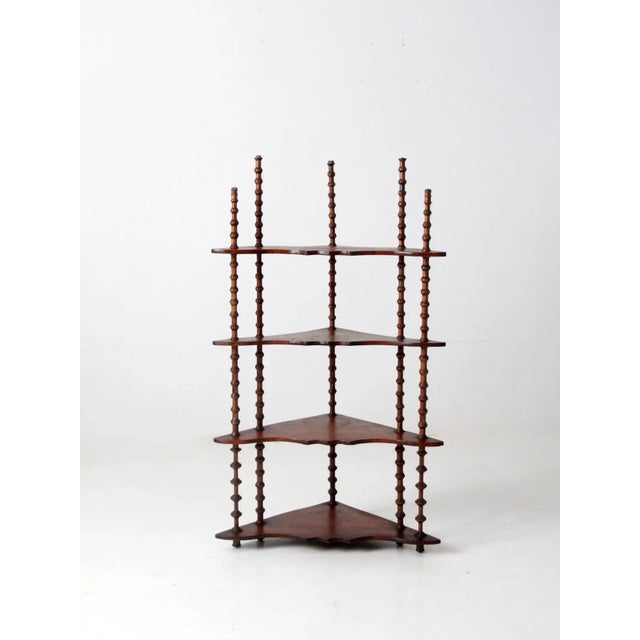 A Victorian era folk art spool shelf, dating to the late 19th century. This unique piece features turned wooden spool-form...