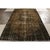 Hand knotted in wool originating from Turkey circa 1960-1970, a vintage 7x11 Art Deco rug from our Mid-Century Pasha...