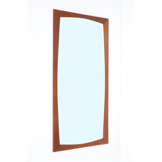 1960s, Denmark. Wall mirror with a solid teak frame. Very high-quality craftsmanship. Rather large for Danish mid-century...