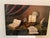 A richly composed vintage still-life painting featuring classical composer Mozart, styled with violin, sheet music, and...