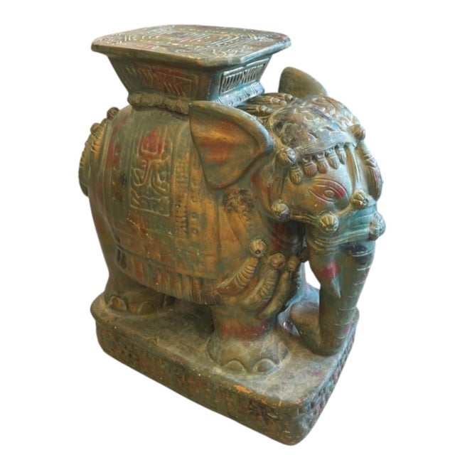 This stunning vintage ceramic garden seat features a beautifully sculpted elephant adorned in elaborate ceremonial dress....