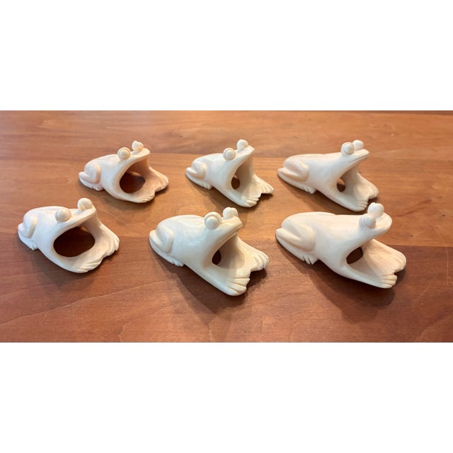 Vintage Set of 6. Each napkin ring features a distinct hand-carved frog silhouette with a smooth, polished finish that...
