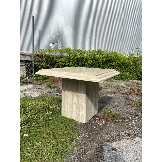 Beautiful Italian Travertine Side Table. Polished at tabletop with a double beveled edge. Remainder of stone is a rough...