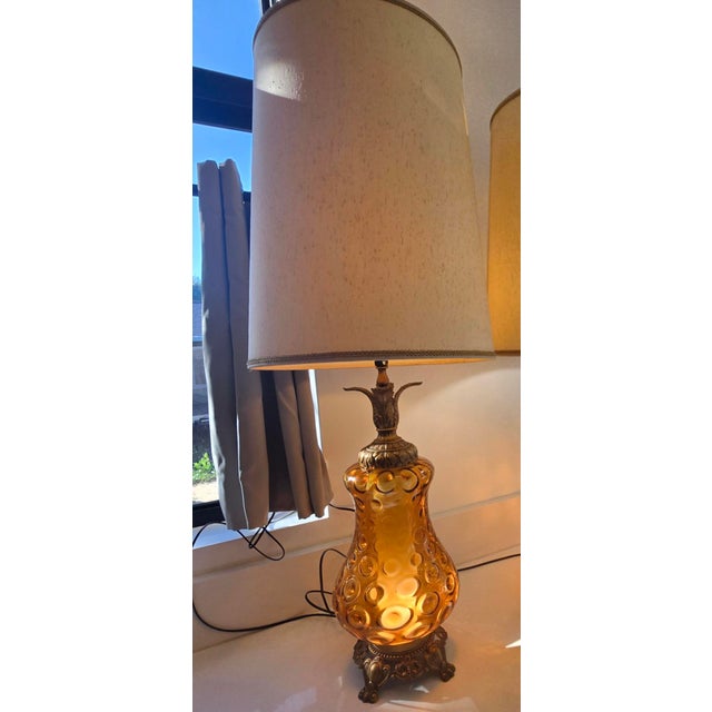 A 45-inch tall Mid-Century Modern table lamp with Hollywood Regency and Spanish Revival styling, dating from the...