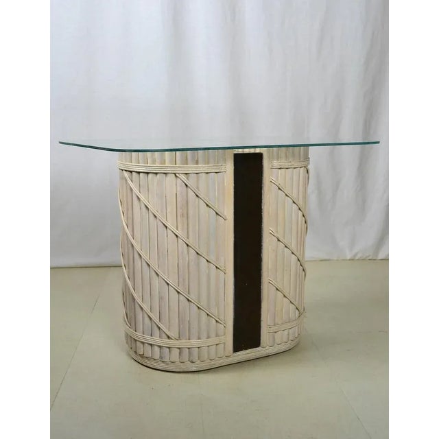 Rare mid century modern oval side table made of whitewashed bamboo with a painted wood center. Rectangular glass top with...