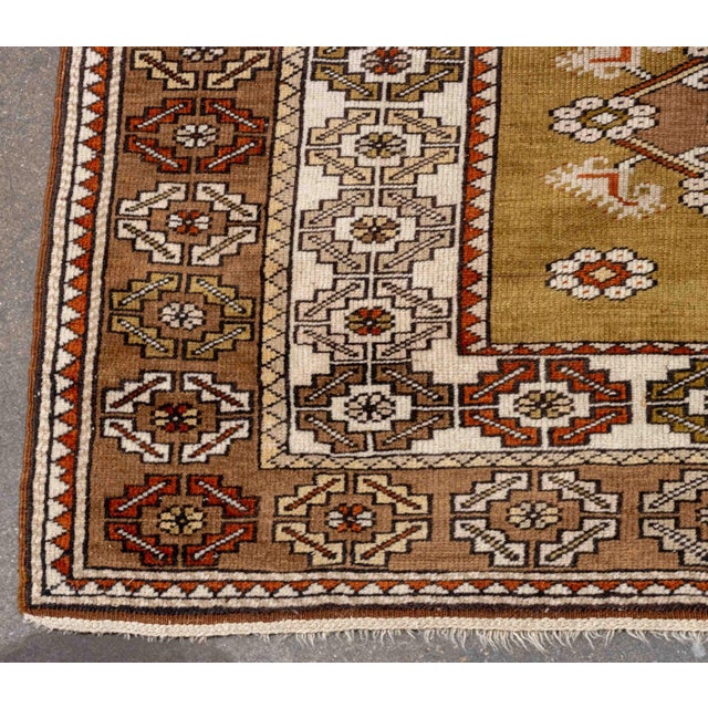 Turkish Eagle Kazak Style Rug, with geometric design on an olive green ground. 6' 6.5" L x 3' 7.5" W. Provenance: From an...