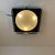 Italian wall and/or ceiling lamp made of a dark taupe enameled metal box with a spherical acrylic glass lampshade in the...