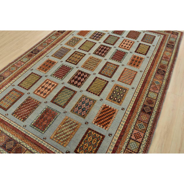 This tribal geometric Barjasta rug is hand-knotted with an all-wool high and low pile on a cotton foundation. This rug is...