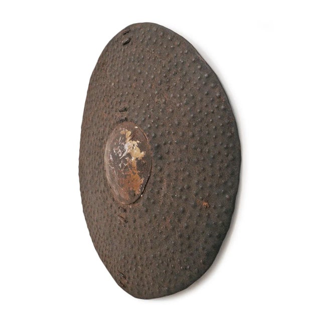 Old round iron Dinka shield from Eastern Africa. Each slightly unique with original aged patina and textures.
