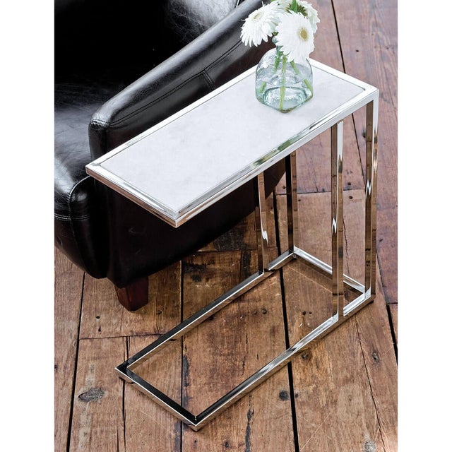 At home in a variety of decors, the Echelon sofa hugger table pairs white marble slab with a polished nickel iron frame....