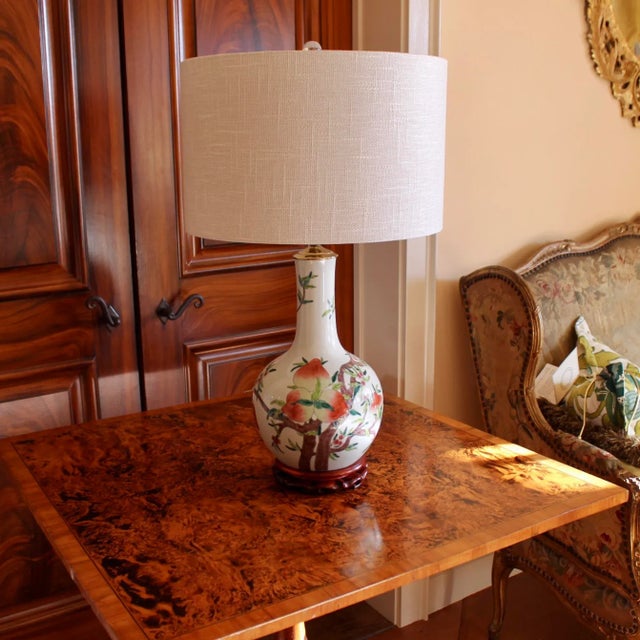 A good size bulbous gourd vase with showy naturalistic decoration of tree branches laden with peaches encircling the...