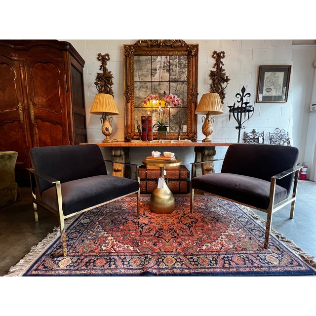 These luxe loungers lean ultra-modern with a square, low-profile shiny brass metal frame and moody carbon black velvet...
