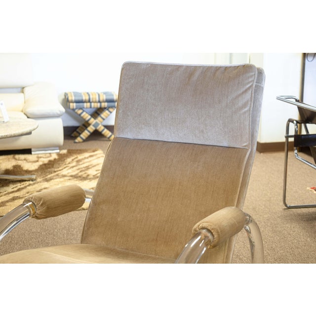 A vintage 1970s Charles Hollis Jones rocking chair and ottoman. This wonderful vintage set is a perfect accent piece to...