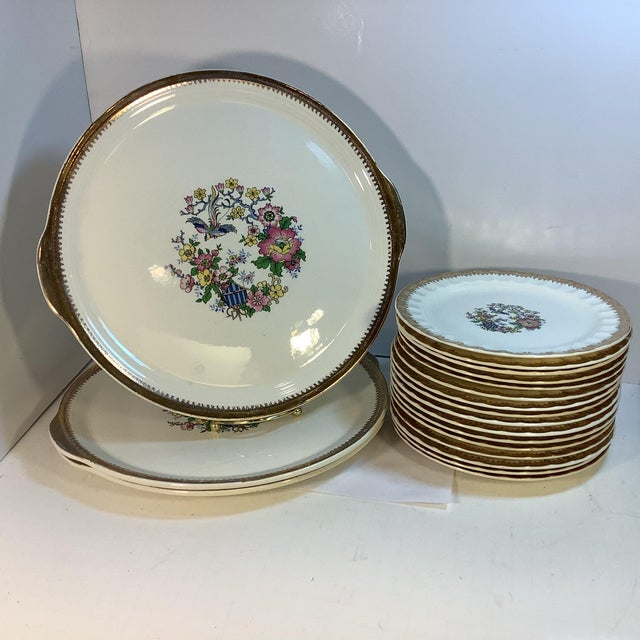 This is a lovely set of appetizer/dessert plates and three platters from the Cronin China Company out of Minerva, OH. The...