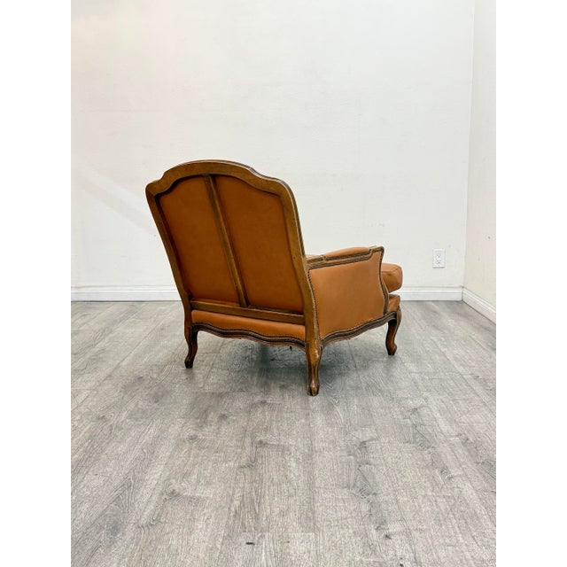 Beautiful leather chair with matching ottoman in good vintage condition