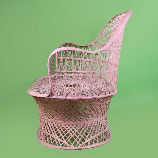 A vintage Russell Woodard settee in spun fiberglass — the maker's iconic web-spun construction — finished in cheerful...