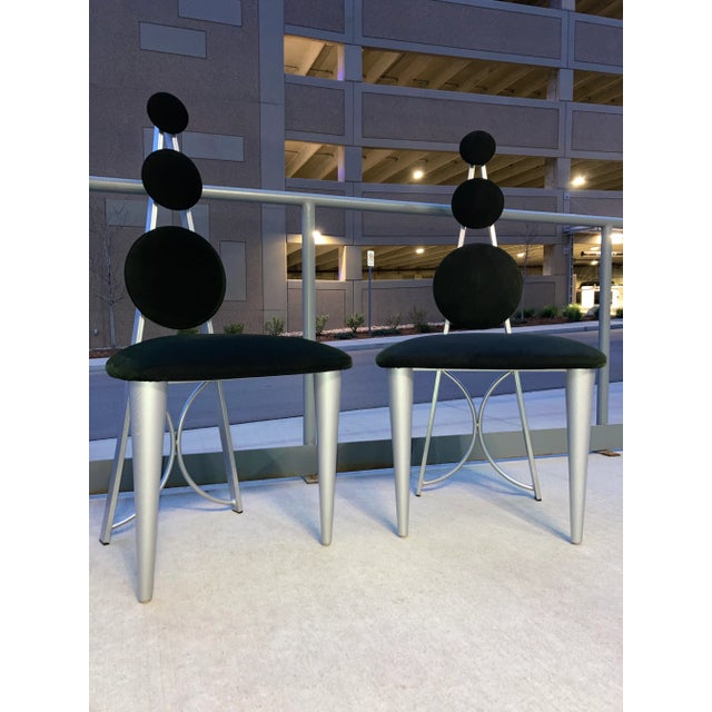Postmodern Memphis style dining chairs featuring steel frame, tapered oak front legs, and triple panel backrest in...