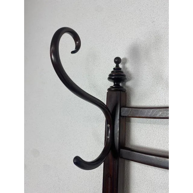 Secession coat hanger J&J Kohn no.905 professionally stained and repolished. This piece is attributed to the mentioned...