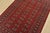 A tribal Bokhara rug hand-knotted with fine wool on a cotton foundation. This rug features rows of repeating medallions...