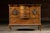 Early 20th-century bow-front serving cabinet constructed of richly figured oak with three central drawers, two flanking...