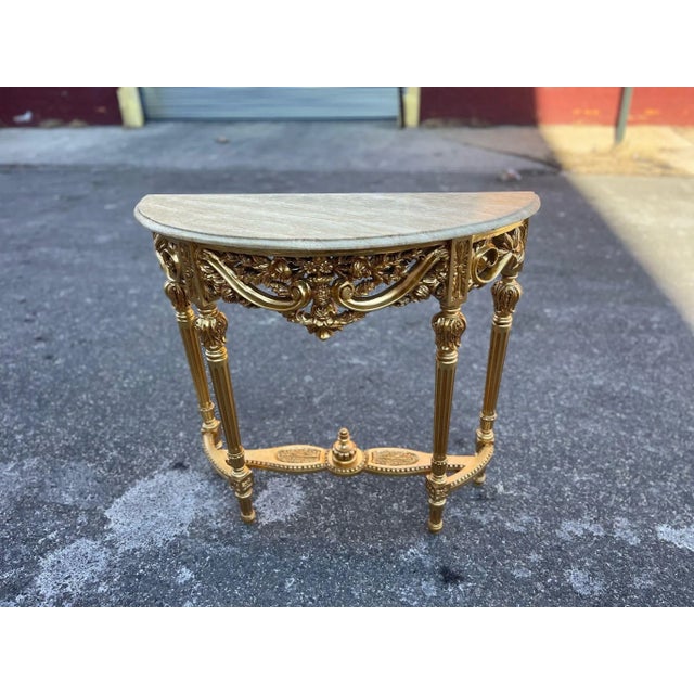 Hand Carved Louis XVI console table in Real Solid wood with Real Natural Marble Top and gilt wood legs gilded in 24 Karat...