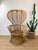 Vintage 1960s Rattan Chair made of rattan natural color tall "peacock" style fan back woven rattan detail at arm in the...