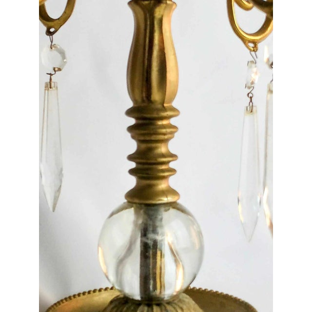 Wonderful 4 arm Candelabra with unique glass bubble and prisms. It stands 11 inches tall, 9 inches wide. Bring some...
