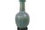 A 1950’s era turquoise Asian ceramic lamp in the style of James Mont with turquoise and green mottled glaze and a...