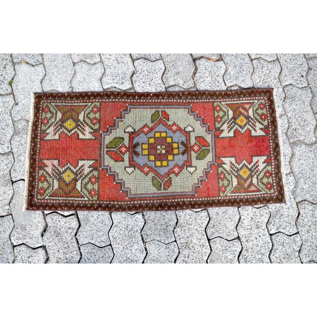 This is a vintage Turkish Oushak rug from the 1960s. The piece was hand-knotted.
