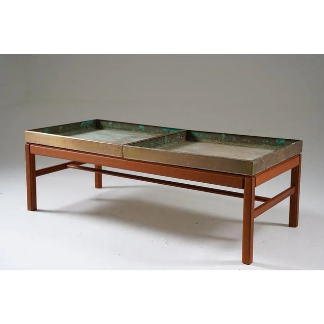 The "Casino" flower table is a piece of furniture designed by Sven Engström and Gunnar Myrstrand. It is made of teak wood...