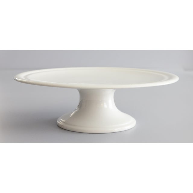 A gorgeous antique white ironstone cake stand on a pedestal made in Holland, circa 1890. Maker's mark on reverse. This...