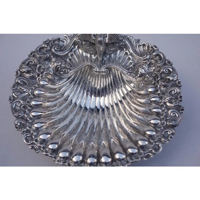 Louis XV style shell-shaped silver plated centerpiece decorated with gadroons, volutes and vegetal interlaces, standing on...